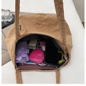 Internal view of khaki corduroy tote bag showing large capacity for daily items