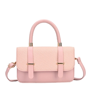 Pink crossbody bag with woven texture flap and golden hardware on white background
