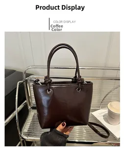 Detail of coffee brown bucket bag with glossy patent leather finish and dual top handles