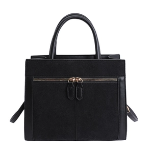 Minimalist black structured handbag with textured suede panels and double zipper accents