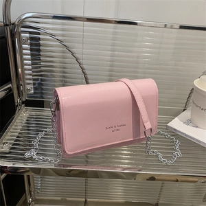 Pink patent leather crossbody bag with chain strap and Sunlita & Fashion print design