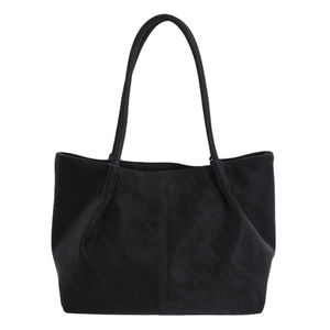 Large black matte tote bag with pleated design and slim shoulder straps for daily commuting