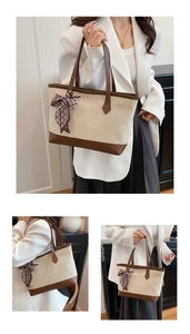 Detail of canvas tote bag with brown leather trim and decorative patterned silk scarf