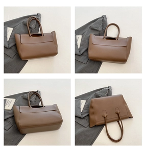 Viste dettagliate di una borsa tote in pelle marrone con manici sottili e capiente