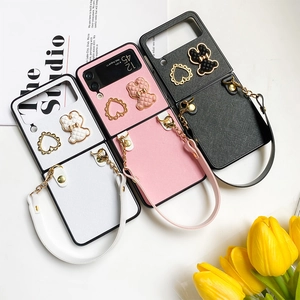 Chic quilted bear and heart charms on Samsung Z Flip cases with leather wrist straps