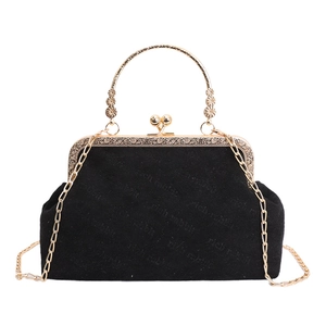 Elegant black velvet crossbody bag with golden floral handle and leopard print chain detail