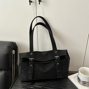 Retro black faux suede shoulder bag with twin silver buckle straps for women