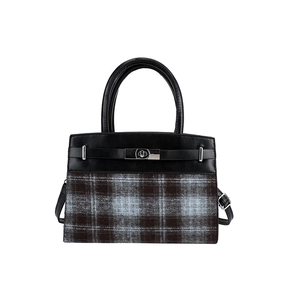 Fashionable women's plaid leather handbag with top handle and metal buckle closure