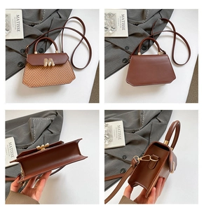 Detail view showing brown woven leather bag texture and gold M-shaped metal hardware lock