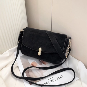 Retro black suede shoulder bag with unique golden peanut clasp and chain strap detail