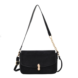 Retro black matte shoulder bag featuring a unique golden peanut-shaped buckle on white background