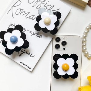 Support de téléphone rétractable en forme de fleur noir et blanc avec perle colorée