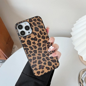 Detail of leopard print phone case with cross-grain texture held in hand for iPhone
