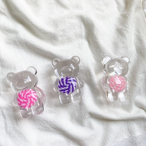 Supports de téléphone ours transparents avec motif de bonbons sur tissu blanc