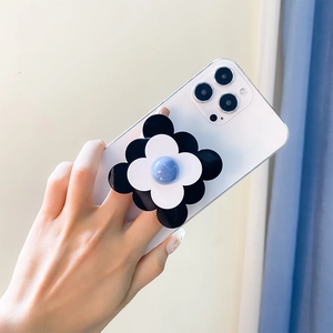 Gros plan détaillé d'un support de téléphone en forme de fleur bicolore avec centre bleu