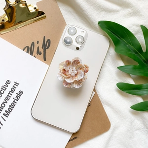 3D floral phone socket with pearlescent petals and delicate white pearls