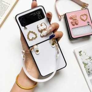 Elegant white Galaxy Z Flip folding phone case with 3D bear, gold heart and wrist strap