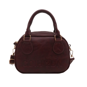 Sac polochon vintage en cuir bordeaux avec poignée et finitions métalliques dorées