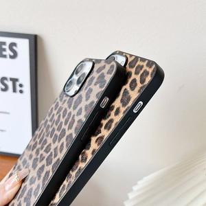 Close-up of leopard print phone cases showing black matte edge protection and precise cutouts