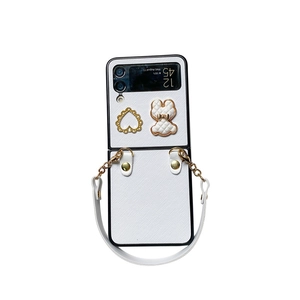 White leather phone case for Samsung Z Flip 6 with heart charm and bear chain strap