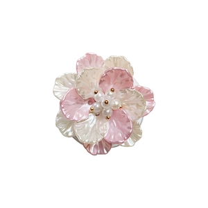 Chic 3D floral cell phone socket grip with pearlescent pink petals and pearl core