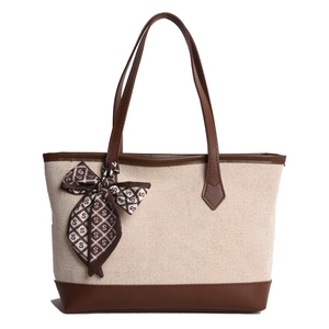 Large beige and brown canvas tote bag with leather trim and decorative silk scarf