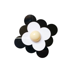 Support de téléphone en fleur noir et blanc avec perle centrale jaune crème luisante