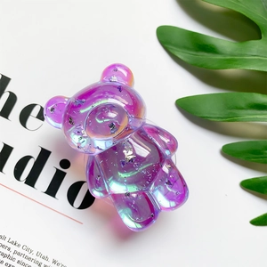 Detail of bear phone grip with purple-pink gradient and holographic laser foil effect