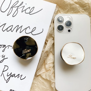 Minimalist metallic expandable phone socket stand with gold electroplated Love design