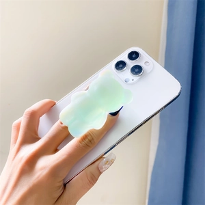 Support de téléphone pliable ours irisé aux couleurs de bonbons sur smartphone