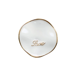 Minimalist white enamel Love phone stand with golden metal edge and retractable design