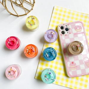 Creative 3D donut phone grip holder with colorful sprinkles and matching plaid phone case