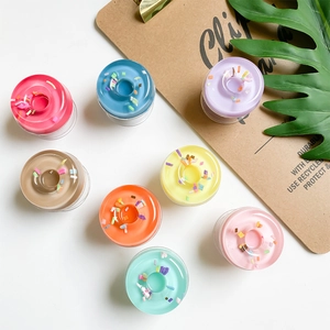 Top view of eight colorful donut-shaped phone grips with realistic sugar sprinkles detail