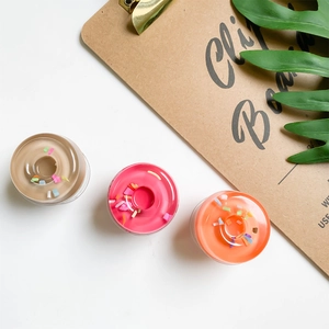Detailed macro view of creative donut-shaped phone sockets in brown, pink and orange colors