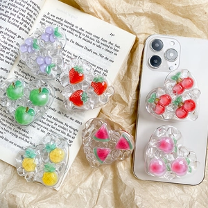 Heart-shaped 3D fruit phone grips with strawberry and peach in resin diamond texture