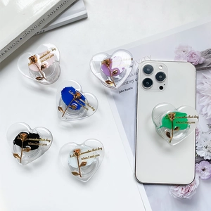 Collapsible heart-shaped phone grips with floral design in six vibrant colors