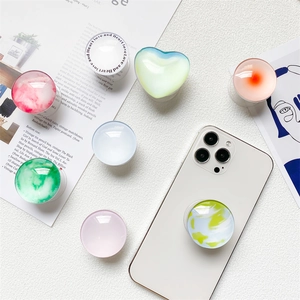 Detail of laser starlight crystal phone socket with heart shape on a white device