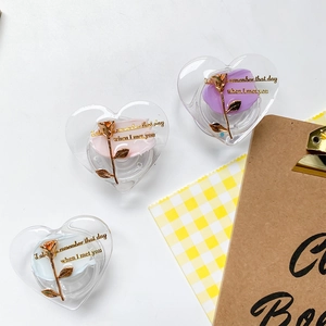 Close-up of heart-shaped phone grips with floral design and elegant metallic rose detail
