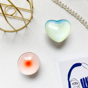 Detail of laser starlight crystal phone grips in heart and round gradient designs