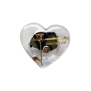Heart-shaped phone grip featuring gold rose and romantic text on a sleek white backdrop