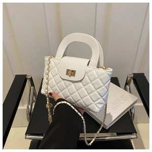 White quilted shoulder bag with gold hardware and stylish semi-circular handle
