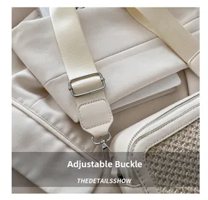 Detail of adjustable silver buckle and nylon strap on a beige woven shoulder bag