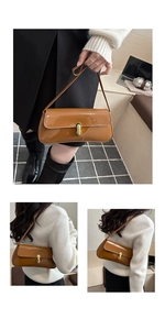 Close-up of brown patent leather bag showing gold buckle and texture detail