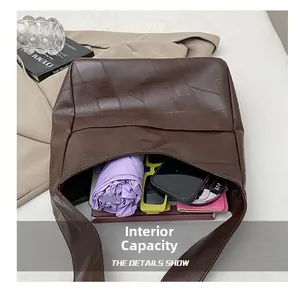 Detailed interior of a vintage brown tote bag showing its large storage capacity