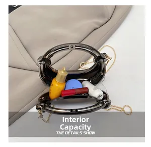 Internal capacity of mini transparent acrylic handbag with metal chain strap