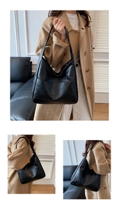 Detail of black patchwork leather tote showing geometric texture and shoulder strap drop