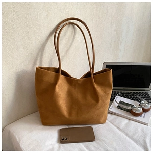 Brown frosted tote bag shown with laptop and books for office or casual use