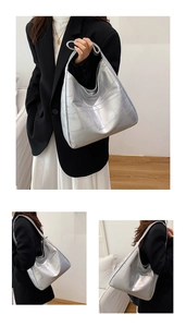 Detail of silver quilted tote bag with metallic finish and spacious interior