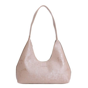 Minimalist metallic pink crescent hobo bag with textured vertical pleats and shoulder strap