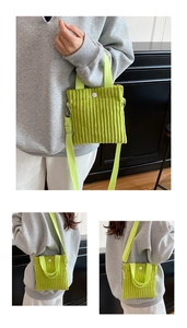 Detail of green corduroy mini tote bag showing the texture and button closure